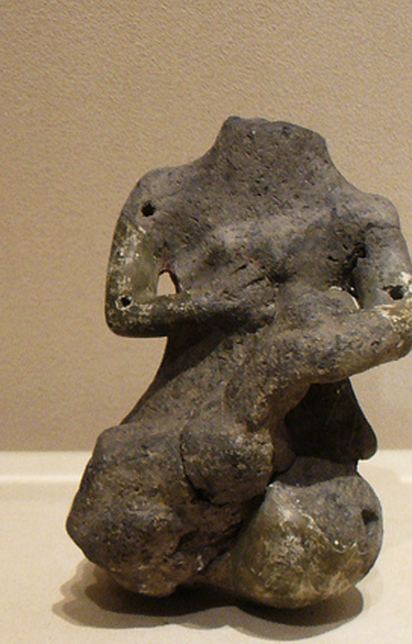 woman nursing a child, fired clay